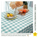 Aqua and white buffalo plaid cotton tablecloth with corner tassels on a large rectangular dining table, 55x102 inches - view 2