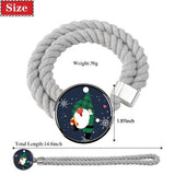 Two gray cotton rope curtain tiebacks with handmade Santa Claus patterns tied around sheer curtain panels - view 4