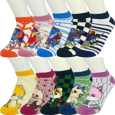 Ten pairs of colorful monster and anime cat character low-cut ankle socks laid flat, assorted multicolor designs