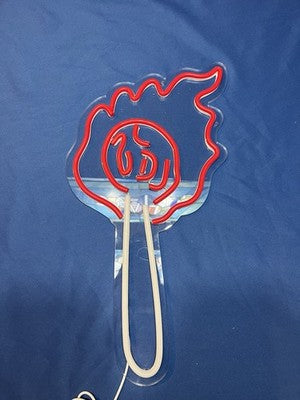 Illuminated acrylic LED torch fire wall sign glowing in red and white, mounted on a dark wall for bar or man cave decor