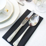 Box of 50 black airlaid disposable napkins measuring 16x16 inches, folded and displayed for wedding table setting - view 3