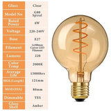 Three G25 amber glass spiral LED Edison bulbs with E26 base standing upright, warm 2000K vintage glow - view 2
