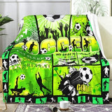 Green flannel throw blanket 60x80 inches with all-over soccer ball print, folded on a sofa, soft anti-pill fabric - view 2