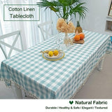 Aqua and white buffalo plaid cotton tablecloth with corner tassels on a large rectangular dining table, 55x102 inches - view 4