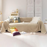 Khaki chenille slipcover with tassel fringe edges draped over a single-cushion chair, 71x71 inch furniture cover
