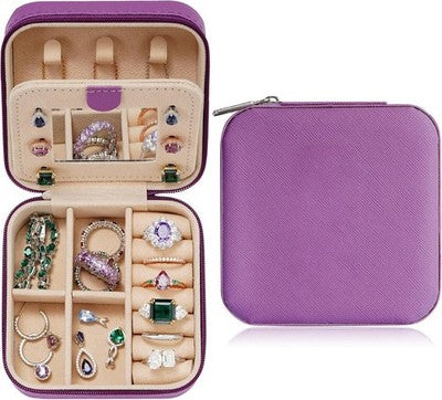 Small purple PU leather travel jewelry case open showing velvet interior, ring roll, and divided compartments, 4x4x2 inches