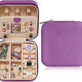 Small purple PU leather travel jewelry case open showing velvet interior, ring roll, and divided compartments, 4x4x2 inches