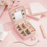 Parima pink PU leather travel jewelry case open showing velvet interior ring roll and divided compartments 4x4x2 inches - view 2