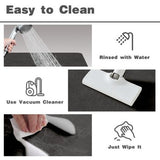 TYUU black 16x24 non-slip bath mat with rubber backing and faux suede surface laid flat on bathroom floor - view 7