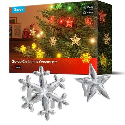30 clear plastic star and snowflake clips for Govee Christmas string lights, 15 of each shape, spread on white surface