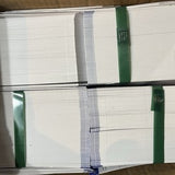 Stack of rectangular coated paper baggage claim check tags numbered in bold red on white, with tear-off stub and transfer tape backing - view 7