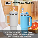 Eight hot pink star-shaped silicone straw covers displayed near Stanley tumblers, dust-proof reusable straw toppers - view 3