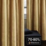 Two gold velvet blackout curtain panels 52x84 inches with silver grommets hanging on a rod in a living room - view 4