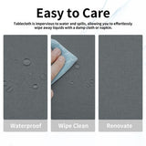 Dark grey rectangular faux linen tablecloth 60x120 inches with pleated corners draped over a dining table, waterproof stain resistant - view 4