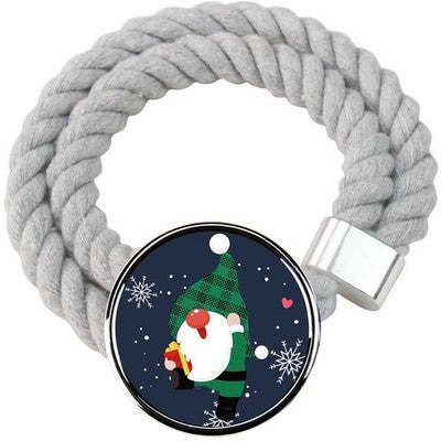 Two gray cotton rope curtain tiebacks with handmade Santa Claus patterns tied around sheer curtain panels