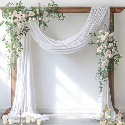 White sheer chiffon fabric panel draped over a wedding arch, 29 inches wide by 19 feet long, flowing elegantly