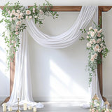 White sheer chiffon fabric panel draped over a wedding arch, 29 inches wide by 19 feet long, flowing elegantly