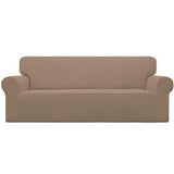 Easy-Going camel check jacquard stretch slipcover fitted snugly over a three-seat sofa with elastic base secured