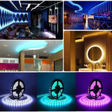 Supernight 32.8ft RGB LED strip lights with 300 LEDs glowing in multiple colors mounted behind a bedroom TV - view 3