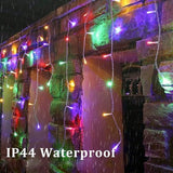 HISHINY 32ft multicolor LED icicle Christmas lights with 72 hanging drops displayed outdoors on roofline at night - view 5