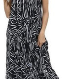 Women's black and white floral boho maxi dress with V-neckline, adjustable spaghetti straps, and side pockets in rayon
