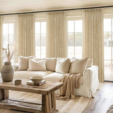 Two natural beige pinch pleat semi-sheer linen blend curtain panels 40x92 inches hanging on a window rod - view 7
