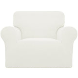 Cream check jacquard stretch slipcover fitted over a standard armchair, showing elastic base and snug one-piece fit