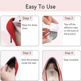 Four OKGL black and yellow self-adhesive heel grip inserts laid flat showing cushioned sponge side and anti-slip surface - view 5