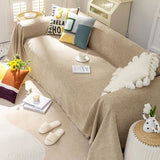 Khaki chenille slipcover with tassel fringe edges draped over a single-cushion chair, 71x71 inch furniture cover - view 6