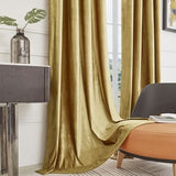 Two gold velvet blackout curtain panels 52x84 inches with silver grommets hanging on a rod in a living room - view 6