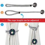 Two gray cotton rope curtain tiebacks with handmade Santa Claus patterns tied around sheer curtain panels - view 2