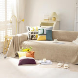 Khaki chenille slipcover with tassel fringe edges draped over a single-cushion chair, 71x71 inch furniture cover - view 7
