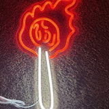 Illuminated acrylic LED torch fire wall sign glowing in red and white, mounted on a dark wall for bar or man cave decor - view 2