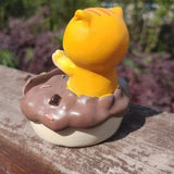 Uniboho kawaii anime cat resin phone stand holding a smartphone upright on a desk with non-slip base - view 4