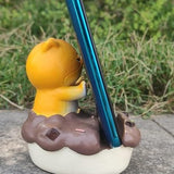 Uniboho kawaii anime cat resin phone stand holding a smartphone upright on a desk with non-slip base - view 3