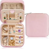 Parima pink PU leather travel jewelry case open showing velvet interior ring roll and divided compartments 4x4x2 inches