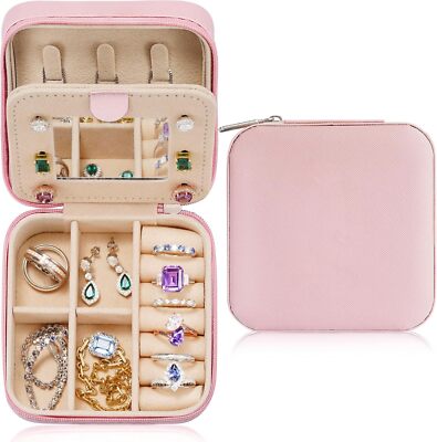 Parima pink PU leather travel jewelry case open showing velvet interior ring roll and divided compartments 4x4x2 inches