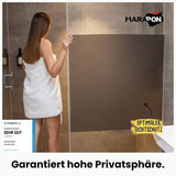 Anthracite grey opaque static cling privacy window film 23.6x78.7 inches applied to a glass window panel - view 2