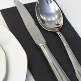 Box of 50 black airlaid disposable napkins measuring 16x16 inches, folded and displayed for wedding table setting - view 4