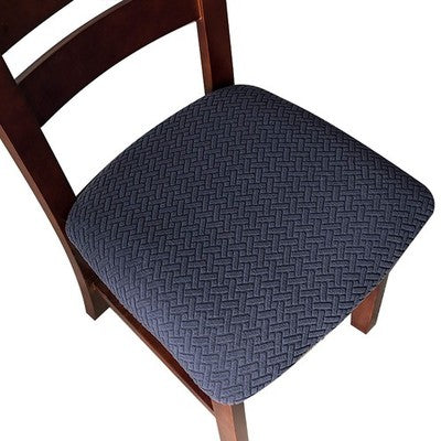 Set of four navy blue stretch dining chair seat covers with rhombic jacquard pattern on wooden kitchen chairs
