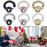 Two gray cotton rope curtain tiebacks with handmade Santa Claus patterns tied around sheer curtain panels - view 5