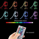 Supernight 32.8ft RGB LED strip lights with 300 LEDs glowing in multiple colors mounted behind a bedroom TV - view 4