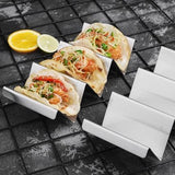 Four stainless steel taco holder racks arranged together, each holding three taco shells upright, 304 steel silver finish - view 5