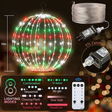 Two 16-inch multicolor LED Christmas ball sphere lights with stainless steel frame glowing outdoors in a yard at night - view 6