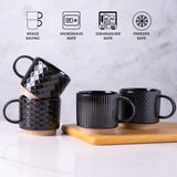 Set of 4 stackable black textured ceramic coffee mugs 12oz arranged in a stack on a white surface - view 7