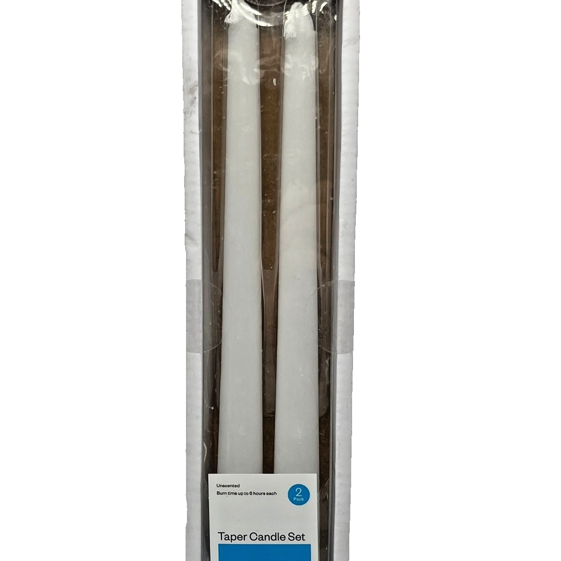 Two white unscented 10-inch taper candles by Room Essentials standing upright, classic slim silhouette for dinner table or mantle