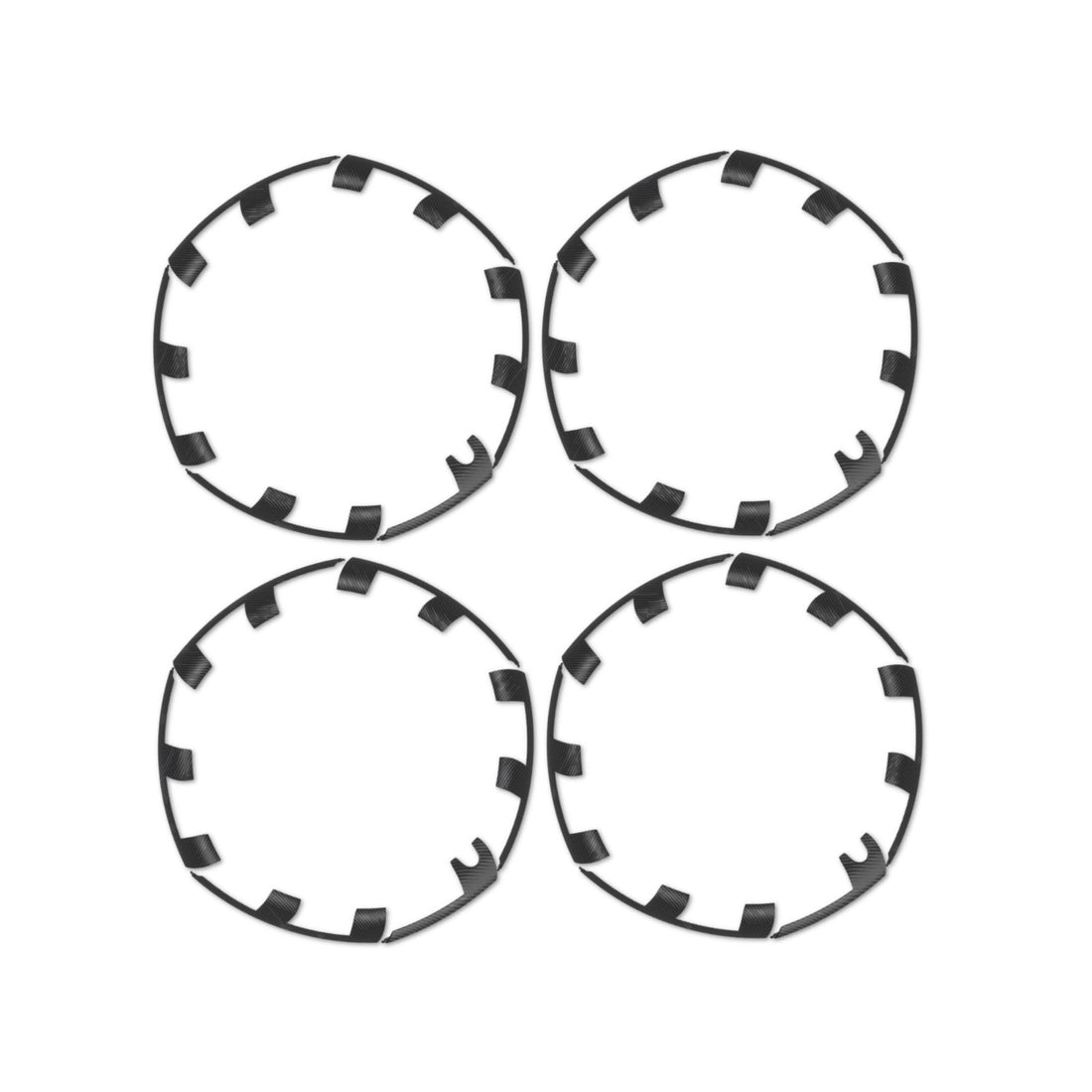 Set of four black ABS plastic rim protectors for 21-inch Tesla Model Y Überturbine wheels shown individually on white background