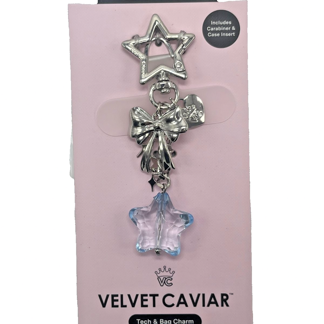 Velvet Caviar silver star carabiner clip charm with metallic bow and light blue faceted crystal star pendant