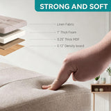 Small square khaki linen storage ottoman with wood legs and reversible lid, 12.6 inches, folded flat beside a living room sofa - view 5
