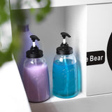 Set of 2 clear glass laundry detergent dispenser bottles with pump, 50oz each, farmhouse-style labels, on laundry room shelf - view 4